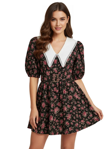 Woman wearing a floral vintage dress with a white doll collar on a white background